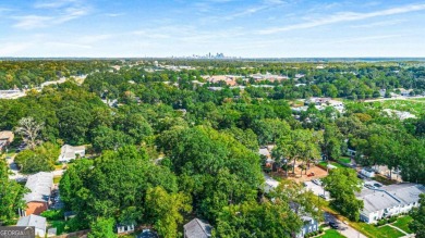 This 3-bedroom, 2-bath brick bungalow blends timeless character on College Park Municipal Golf Course in Georgia - for sale on GolfHomes.com, golf home, golf lot