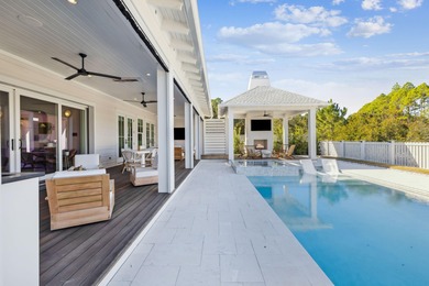 This Stunning 5-bedroom, 5.5-bath luxury residence overlooks the on Origins Golf Club in Florida - for sale on GolfHomes.com, golf home, golf lot