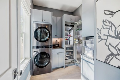 This Stunning 5-bedroom, 5.5-bath luxury residence overlooks the on Origins Golf Club in Florida - for sale on GolfHomes.com, golf home, golf lot