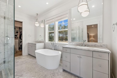 This Stunning 5-bedroom, 5.5-bath luxury residence overlooks the on Origins Golf Club in Florida - for sale on GolfHomes.com, golf home, golf lot