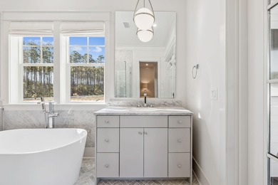 This Stunning 5-bedroom, 5.5-bath luxury residence overlooks the on Origins Golf Club in Florida - for sale on GolfHomes.com, golf home, golf lot