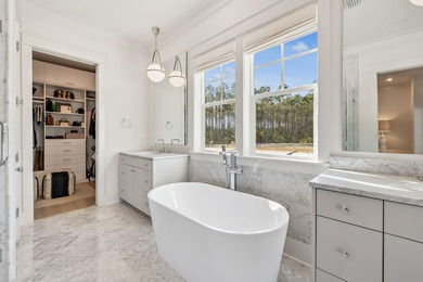 This Stunning 5-bedroom, 5.5-bath luxury residence overlooks the on Origins Golf Club in Florida - for sale on GolfHomes.com, golf home, golf lot