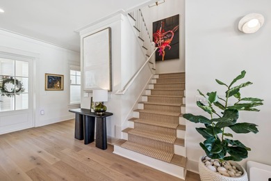 This Stunning 5-bedroom, 5.5-bath luxury residence overlooks the on Origins Golf Club in Florida - for sale on GolfHomes.com, golf home, golf lot