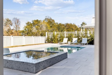 This Stunning 5-bedroom, 5.5-bath luxury residence overlooks the on Origins Golf Club in Florida - for sale on GolfHomes.com, golf home, golf lot