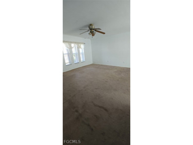 This cozy 3 bedroom, 2 bathroom pool home located in SW Cape on Royal Tee Country Club in Florida - for sale on GolfHomes.com, golf home, golf lot