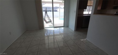 This cozy 3 bedroom, 2 bathroom pool home located in SW Cape on Royal Tee Country Club in Florida - for sale on GolfHomes.com, golf home, golf lot