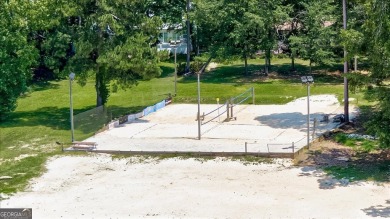 Start collecting lake-life stories before summer slips away on Turtle Cove Golf Course in Georgia - for sale on GolfHomes.com, golf home, golf lot