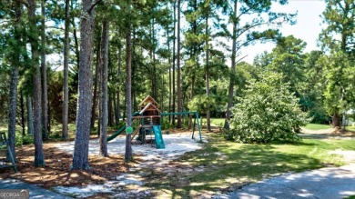 Start collecting lake-life stories before summer slips away on Turtle Cove Golf Course in Georgia - for sale on GolfHomes.com, golf home, golf lot