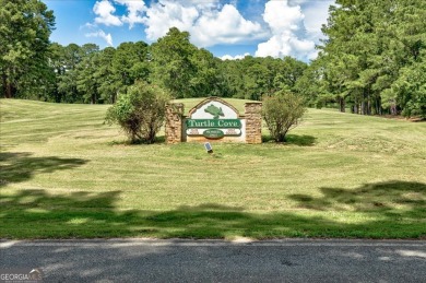 Start collecting lake-life stories before summer slips away on Turtle Cove Golf Course in Georgia - for sale on GolfHomes.com, golf home, golf lot