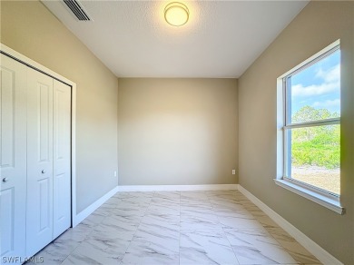 Brand new concrete block house with four (4) bedrooms, two (2) on Mirror Lakes Golf Club in Florida - for sale on GolfHomes.com, golf home, golf lot