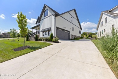 This craftsman style home features 4 bedrooms and 3.5 bathrooms on Tennessee National Golf Club in Tennessee - for sale on GolfHomes.com, golf home, golf lot
