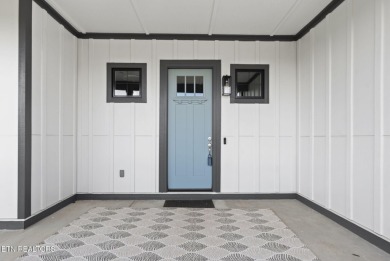 This craftsman style home features 4 bedrooms and 3.5 bathrooms on Tennessee National Golf Club in Tennessee - for sale on GolfHomes.com, golf home, golf lot