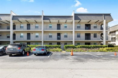 Effortless living starts here! Attractive ground-floor unit on Bayou Golf Club in Florida - for sale on GolfHomes.com, golf home, golf lot