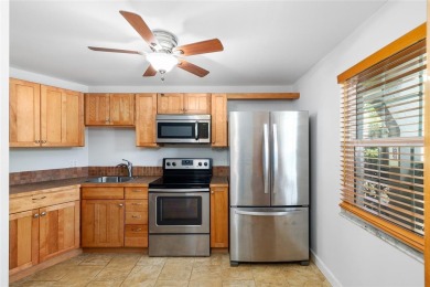 Effortless living starts here! Attractive ground-floor unit on Bayou Golf Club in Florida - for sale on GolfHomes.com, golf home, golf lot