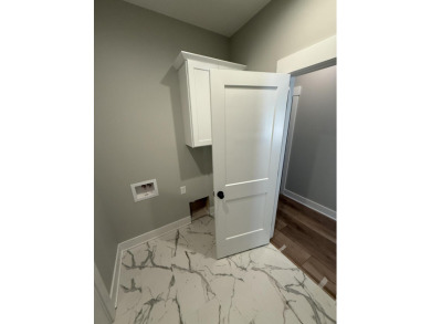 Welcome home to this brand new Andrew Ulberg Builders ranch in on Canadian Lakes Country Club-The Royal Course in Michigan - for sale on GolfHomes.com, golf home, golf lot