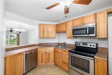 Effortless living starts here! Attractive ground-floor unit on Bayou Golf Club in Florida - for sale on GolfHomes.com, golf home, golf lot