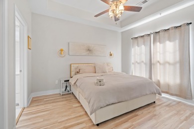 Modern and fully furnished 2 bed, 2 bath top-floor unit in on Barefoot Resort and Golf Club  in South Carolina - for sale on GolfHomes.com, golf home, golf lot