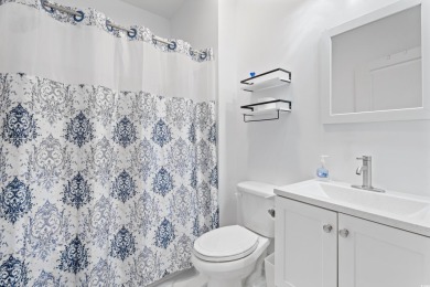 Modern and fully furnished 2 bed, 2 bath top-floor unit in on Barefoot Resort and Golf Club  in South Carolina - for sale on GolfHomes.com, golf home, golf lot