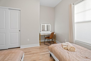 Modern and fully furnished 2 bed, 2 bath top-floor unit in on Barefoot Resort and Golf Club  in South Carolina - for sale on GolfHomes.com, golf home, golf lot
