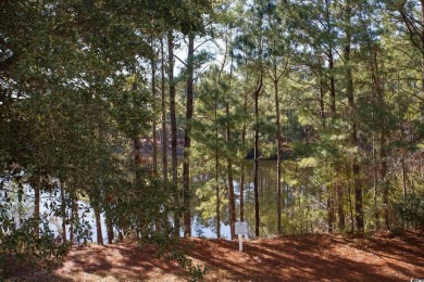 Modern and fully furnished 2 bed, 2 bath top-floor unit in on Barefoot Resort and Golf Club  in South Carolina - for sale on GolfHomes.com, golf home, golf lot
