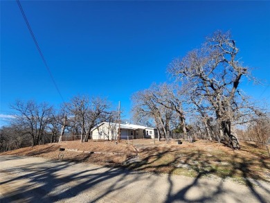 INVESTMENT!!INVESTMENT!! This home has Great bones and is ready on Nocona Hills Golf Course in Texas - for sale on GolfHomes.com, golf home, golf lot