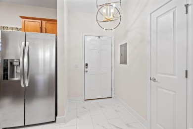 Modern and fully furnished 2 bed, 2 bath top-floor unit in on Barefoot Resort and Golf Club  in South Carolina - for sale on GolfHomes.com, golf home, golf lot