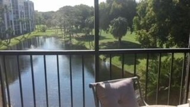 BEAUTIFUL CORNER UNIT WITH EAST EXPOSURE, LAKE, GOLF COURSE, AND on The Country Club At Boca Raton in Florida - for sale on GolfHomes.com, golf home, golf lot