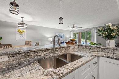 Maintenance free living in Feathersound awaits in the desirable on Feather Sound Country Club in Florida - for sale on GolfHomes.com, golf home, golf lot