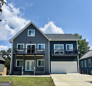 Welcome to this large new modern home in the Innsbruck Golf on Innsbruck Resort and Golf Club in Georgia - for sale on GolfHomes.com, golf home, golf lot