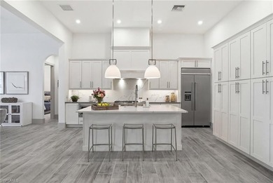 Stunning luxury coastal living in the highly sought-after Marsh on The Golf Club At Fiddlers Creek in Florida - for sale on GolfHomes.com, golf home, golf lot