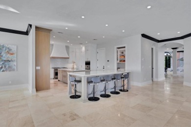 A luxurious coastal retreat at the water's edge on Longboat Key on Links on Longboat Golf Club in Florida - for sale on GolfHomes.com, golf home, golf lot