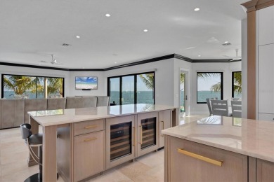 A luxurious coastal retreat at the water's edge on Longboat Key on Links on Longboat Golf Club in Florida - for sale on GolfHomes.com, golf home, golf lot
