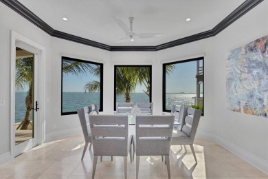 A luxurious coastal retreat at the water's edge on Longboat Key on Links on Longboat Golf Club in Florida - for sale on GolfHomes.com, golf home, golf lot