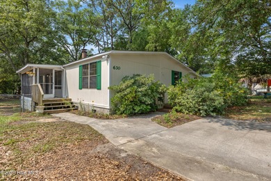 *PRICE REDUCED* This well-maintained home, with a fenced-in on Oyster Bay Golf Links in North Carolina - for sale on GolfHomes.com, golf home, golf lot
