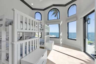 A luxurious coastal retreat at the water's edge on Longboat Key on Links on Longboat Golf Club in Florida - for sale on GolfHomes.com, golf home, golf lot