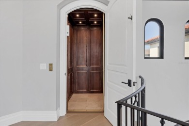 A luxurious coastal retreat at the water's edge on Longboat Key on Links on Longboat Golf Club in Florida - for sale on GolfHomes.com, golf home, golf lot