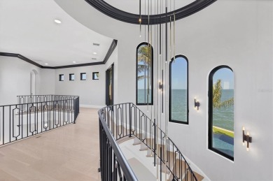 A luxurious coastal retreat at the water's edge on Longboat Key on Links on Longboat Golf Club in Florida - for sale on GolfHomes.com, golf home, golf lot