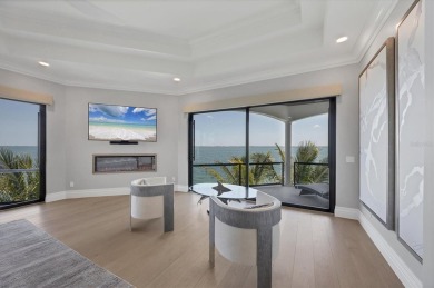 A luxurious coastal retreat at the water's edge on Longboat Key on Links on Longboat Golf Club in Florida - for sale on GolfHomes.com, golf home, golf lot