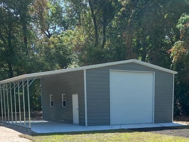 This stunning *Campbell* Pafford built home is tucked away in a on Wildwood Country Club in Florida - for sale on GolfHomes.com, golf home, golf lot