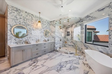 A luxurious coastal retreat at the water's edge on Longboat Key on Links on Longboat Golf Club in Florida - for sale on GolfHomes.com, golf home, golf lot