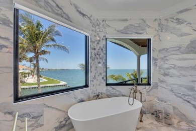 A luxurious coastal retreat at the water's edge on Longboat Key on Links on Longboat Golf Club in Florida - for sale on GolfHomes.com, golf home, golf lot