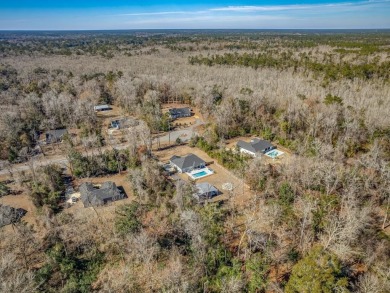 This stunning *Campbell* Pafford built home is tucked away in a on Wildwood Country Club in Florida - for sale on GolfHomes.com, golf home, golf lot