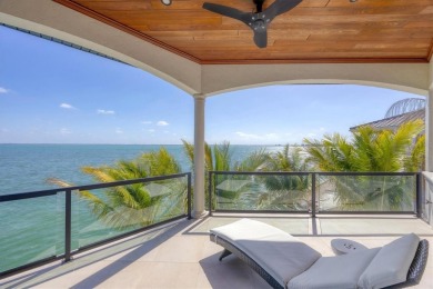 A luxurious coastal retreat at the water's edge on Longboat Key on Links on Longboat Golf Club in Florida - for sale on GolfHomes.com, golf home, golf lot