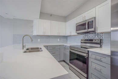 Welcome to this attractive remodeled condo with 2 split bedrooms on Feather Sound Country Club in Florida - for sale on GolfHomes.com, golf home, golf lot