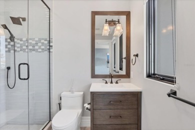 A luxurious coastal retreat at the water's edge on Longboat Key on Links on Longboat Golf Club in Florida - for sale on GolfHomes.com, golf home, golf lot