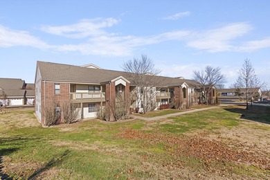 Discover refined living at its best in this pristine corner-unit on Pointe Royale Village Country Club in Missouri - for sale on GolfHomes.com, golf home, golf lot