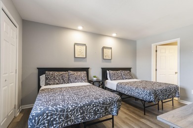 Discover refined living at its best in this pristine corner-unit on Pointe Royale Village Country Club in Missouri - for sale on GolfHomes.com, golf home, golf lot