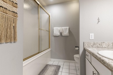 Discover refined living at its best in this pristine corner-unit on Pointe Royale Village Country Club in Missouri - for sale on GolfHomes.com, golf home, golf lot