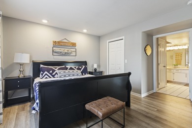 Discover refined living at its best in this pristine corner-unit on Pointe Royale Village Country Club in Missouri - for sale on GolfHomes.com, golf home, golf lot