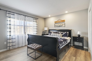 Discover refined living at its best in this pristine corner-unit on Pointe Royale Village Country Club in Missouri - for sale on GolfHomes.com, golf home, golf lot